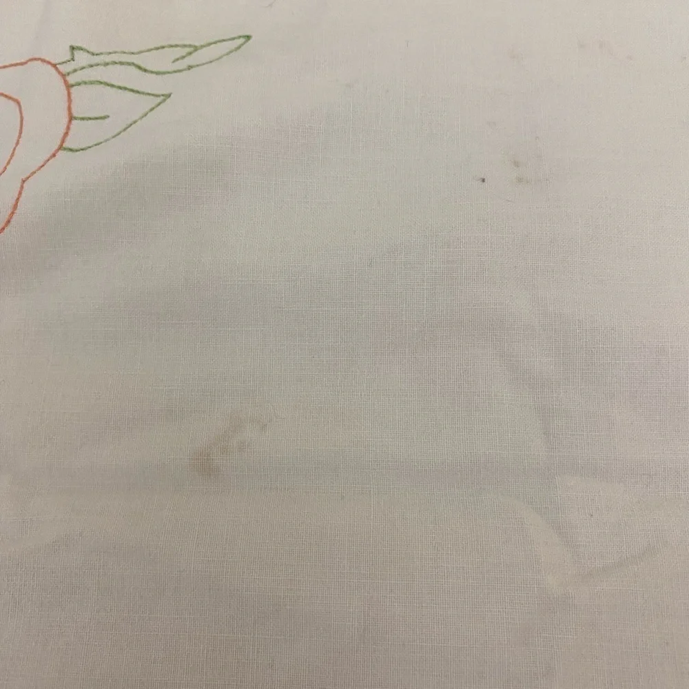 Vintage tablecloth embroidered roses and leaves on corners shows OSB